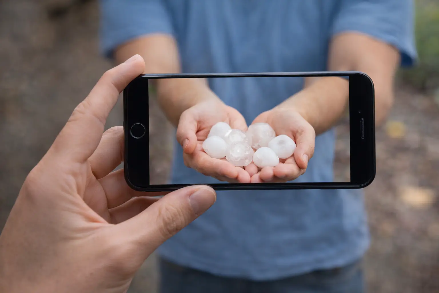 Hailstones on residential property in Colorado Springs after severe hailstorm requiring immediate damage documentation